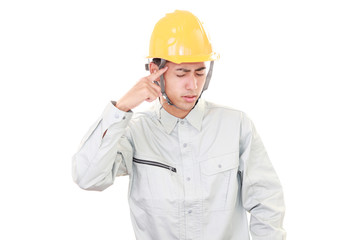 疲れた表情の労働者