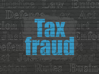 Law concept: Tax Fraud on wall background