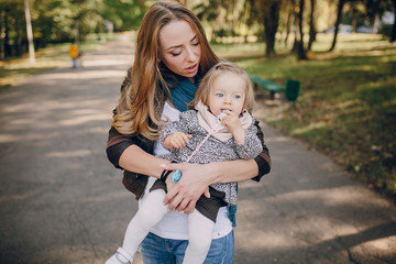 Fototapeta premium young family walking in the park