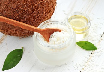 
Cosmetic container of dried coconut shavings, coconut, coconut oil. 
