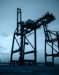 Cargo port in the evening，The silhouette of gantry crane