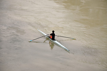 Man kayaking on theTiber river in Rome