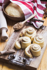 Making cinnamon buns. Homemade yeast dough after raising