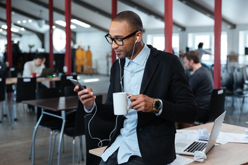 Young businessman texting message on the smartphone