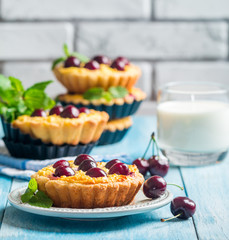 Small tarts with fresh cherries