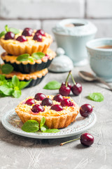 Small tarts with fresh cherries