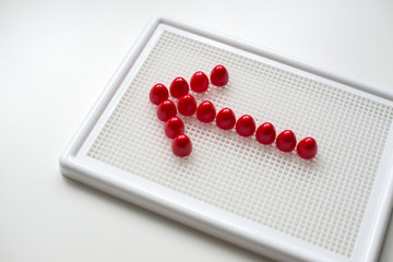 Children's developing game and red arrow on it. Red arrow isolat