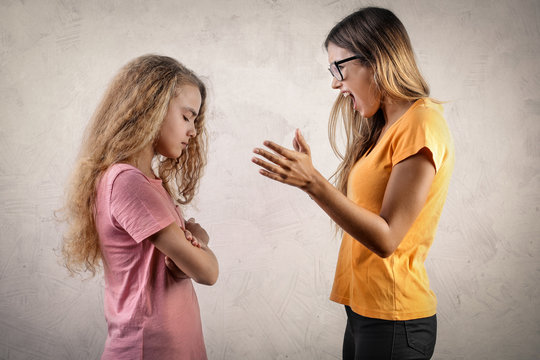 Angry girl blaming her sister