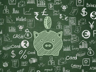 Money concept: Money Box With Coin on School board background