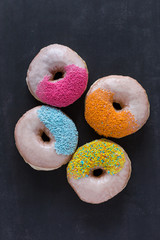 Assorted donuts r on black background