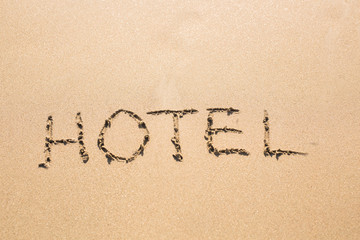 word HOTEL on the sand