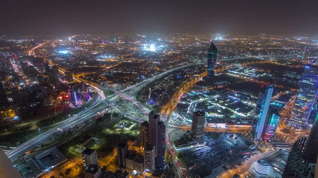 Skyline with Skyscrapers night timelapse in Kuwait City downtown illuminated at dusk. Kuwait City, Middle East