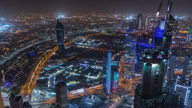 Skyline with Skyscrapers night timelapse in Kuwait City downtown illuminated at dusk. Kuwait City, Middle East