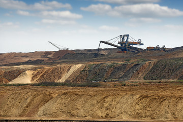 Giant excavator working on open pit coal mine