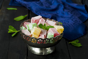 Fototapeta premium lokum - traditional Turkish sweets on a dark background