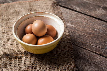 eggs in a bowl on the table from the old boards