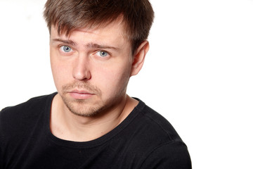 Obraz premium Portrait of serious young man, questioning expression,horizontal, on white