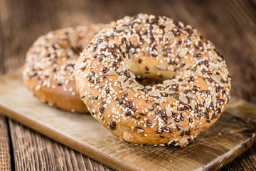 Wholemeal Bagels on wooden background