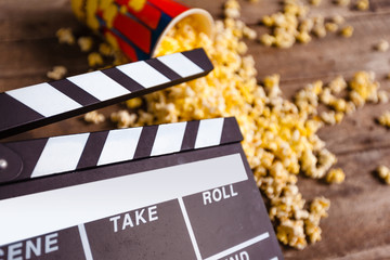 Movie clapper board and pop corn