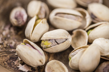 Whole Pistachios on wood
