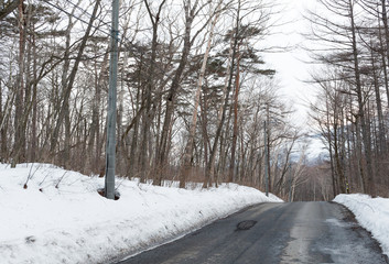 Obraz premium Asphalted road covered with snow