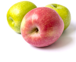 Red and green apples on white background