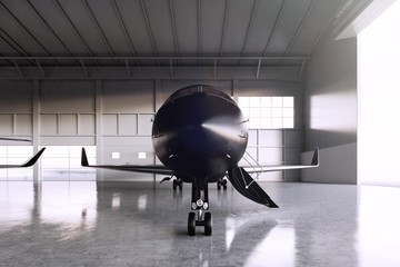 Photo of Black Matte Luxury Generic Design Private Jet parking in hangar airport. Concrete floor. Business Travel Picture. Horizontal, front view. Film Effect. 3D rendering.