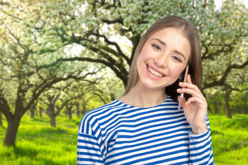 Young elegant woman talking on mobile phone