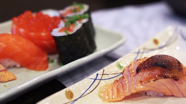 Japanese food set assorted salmon nigiri sushi set, aburi, miso, fish roe and maki 