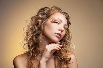 Blonde model with yellow decorative eyelashes