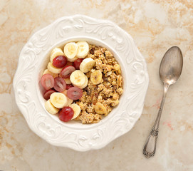 Muesli with banana, grapes and milk. healthy Breakfast.