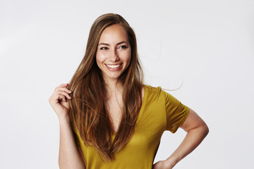 Fototapeta premium Confident woman in white studi