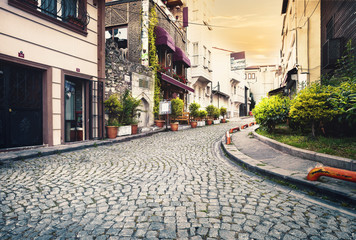 Stone-paved street at sunset © alexlukin