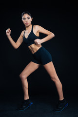 Fototapeta na wymiar Full length portrait of a fitness woman