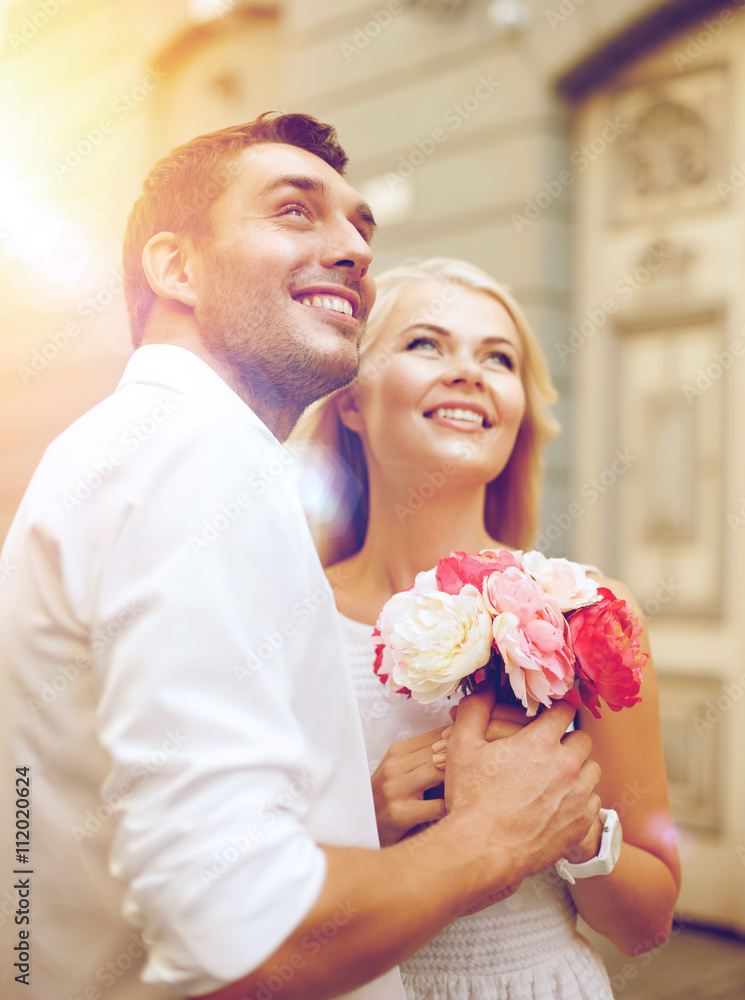 Poster couple with flowers in the city