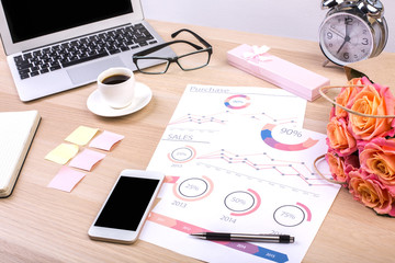 Designer desktop with business report