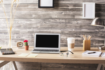 Blank laptop on desktop