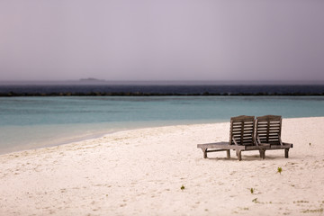 beach chairs on the tropical sand beach