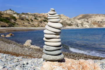 Fototapeta na wymiar Stacked stones on sea