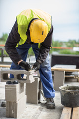 Worker sawing the air block. 