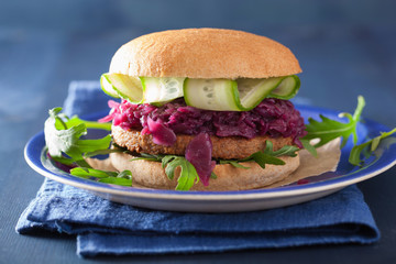 veggie soy burger with pickled red cabbage cucumber arugula