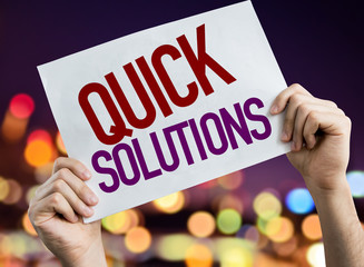 Quick Solutions placard with bokeh background