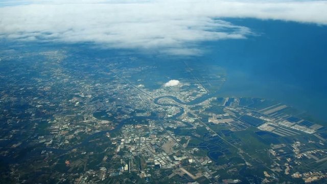 Aerial view : River and sea bay, cloud running above. 