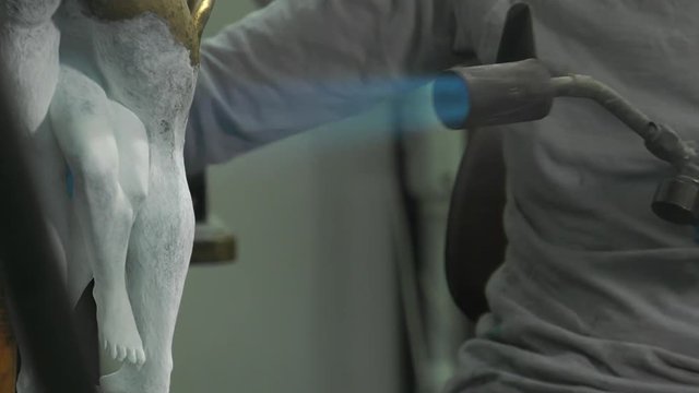 laying a patina from titanium white on bronze