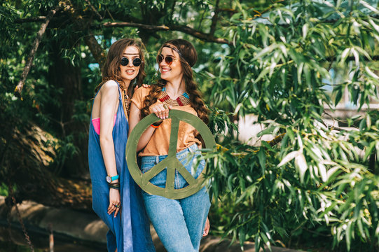 two girls near hippie tree