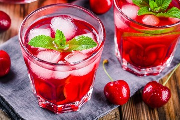 cherry lemonade with ice and mint in glasses