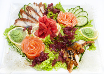 Japanese cuisine sashimi with vegetables and fish in a restaurant