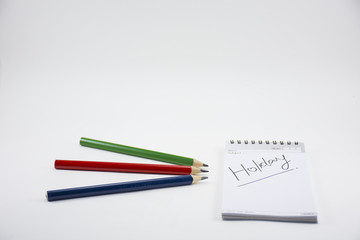 Background business isolated.With note book and pencil and holiday story.On white background
