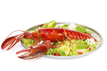 lobster with fresh herbs and lemon on a white background