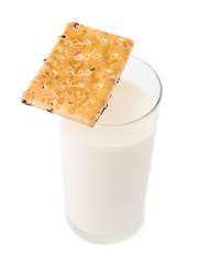 Fototapeta na wymiar Glass of milk and cookie isolated over the white background